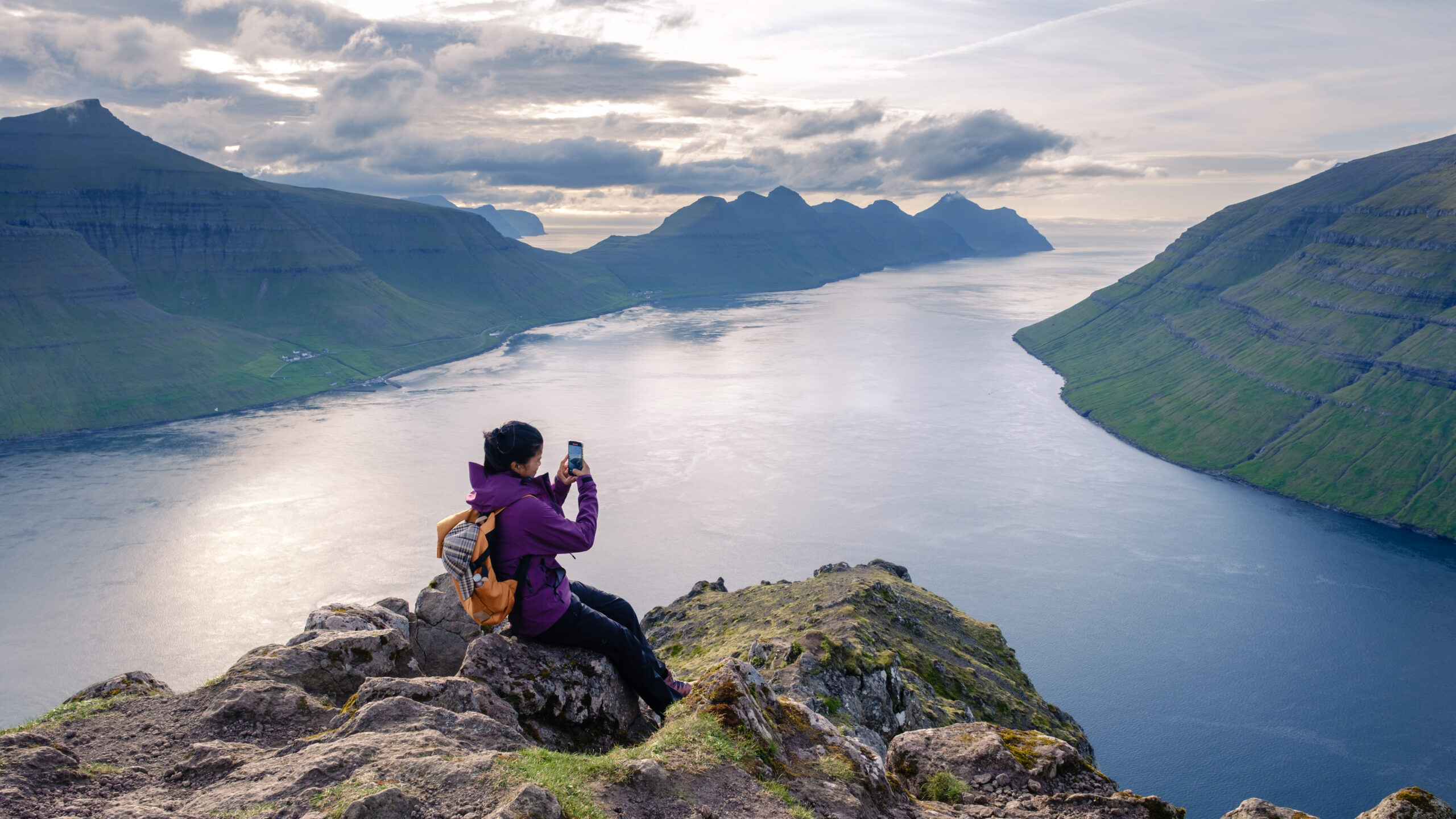Senior woman enjoying a mountain view during a hike